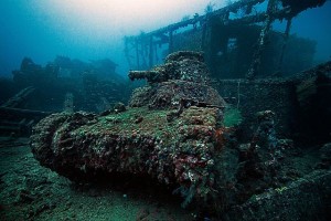 Japanese ship San-Francisco-Maru and tank encrusted with marine life in the lagoon at Truk Atoll, Micronesia, South Pacific, make up a tiny fraction of the undersea debris of  WWII.   Internet photo