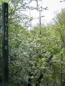 One of 25 signposts at road crossings over streams and river in Middleton.  This post is attached to the Peabody Street Bridge where it crosses over the Ipswich River.  -  Judy Schneider photo  